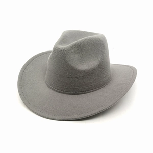 Close-up of dark grey wool felt cowboy hat texture and curved brim detail