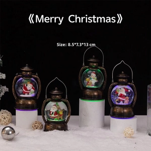 Detail of vintage bronze LED Christmas lantern globes with Santa and snowman scenes