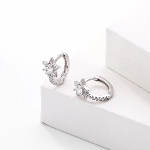 Detailed macro view of S925 sterling silver star earrings with pavé zircon stones