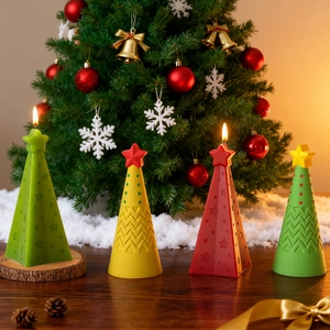 Detail of star-topped cone Christmas tree candles with intricate textured patterns