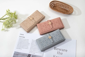 Three long floral wallets with checkered pattern and elegant metal flower buckle details