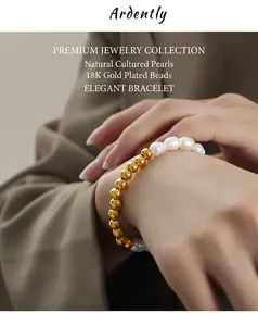 Detailed close-up of baroque pearl and 18K gold-plated beaded bracelet on woman wrist