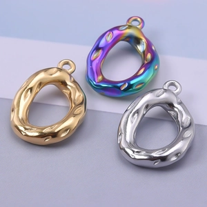 Three teardrop metal pendants with hammered texture in gold silver and rainbow plating