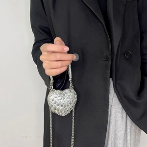 Silver heart-shaped mini evening bag with sparkling rhinestones and metal chain strap