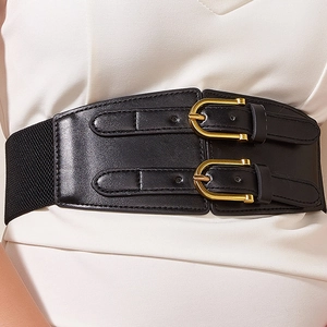 Detail of a wide black elastic waist belt featuring two stylish golden buckles for women