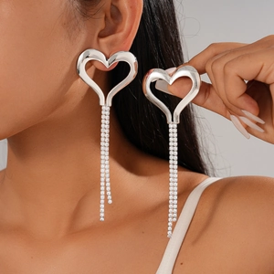 Chic silver hollow heart tassel earrings with sparkling rhinestones for a luxury look