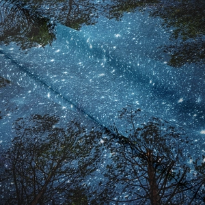 Detailed macro view of starry forest tapestry fabric texture and soft fabric folds