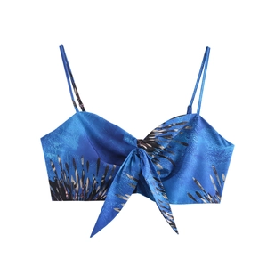 Boho blue floral print crop top with thin straps and tie-front design on white background