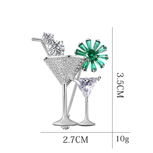 Elegant silver cocktail glass brooch with white zircons and green crystal flower detail