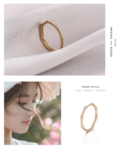 Close-up detail of rose gold bamboo style stainless steel ring for women