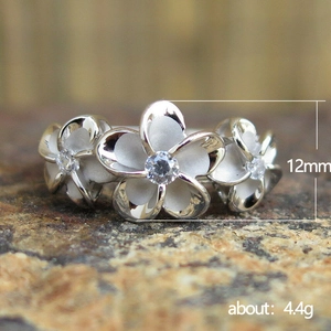 Minimalist silver frangipani flower ring with matte finish and zircon center, 12mm height