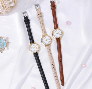 Elegant women's quartz watches with slim leather straps in black, beige, and brown colors