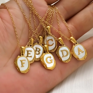 Gold-plated shell letter necklaces with lava texture pendants and shell inlays