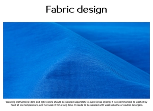 Detail of blue textured fabric with fabric design and washing instructions guide