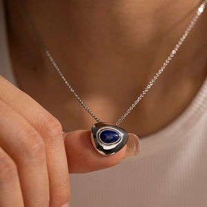 French vintage titanium steel necklace featuring a polished silver chain and blue lapis lazuli