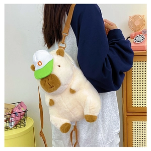 Detailed back view of a cute plush capybara backpack with green hat on a model