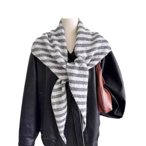 Chic grey and white striped wool blend knit triangle shawl scarf over a leather jacket