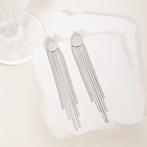 Elegant silver long tassel drop earrings with freshwater pearls on white marble stones