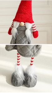 Detail of a Christmas gnome featuring a red knit hat, wooden nose, and white fur boots