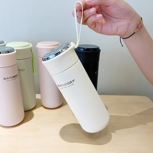 Gourde isotherme portable en acier inoxydable blanc avec poignée en silicone et fini mat