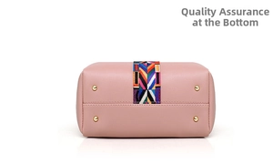 Detail view of pink bucket bag base with ethnic woven strap and golden protective studs