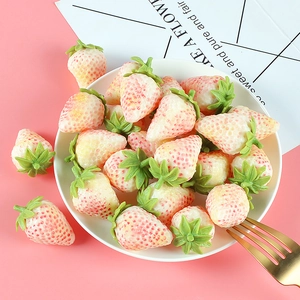 Realistic artificial white strawberry props displayed on a plate for painting and decor