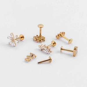 G23 titanium flat back stud earrings set with gold finish and sparkling zircon stones