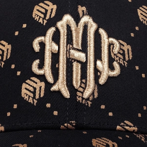 Detail of black baseball cap with premium gold 3D embroidery and vintage lettering