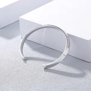 Polished minimalist silver cuff bracelet for women in a sleek open-style design