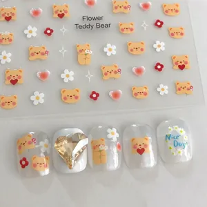 Detail of YO-020 nail art stickers featuring yellow bears and floral patterns