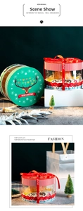 Detail of round Christmas gift box with transparent window and Merry Christmas lid