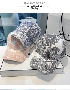 Detailed close-up of high-density cotton baseball caps featuring retro jungle prints
