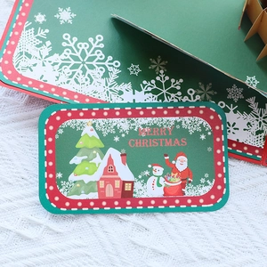3D pop-up Christmas card with festive wreath and Santa Claus on white woven background