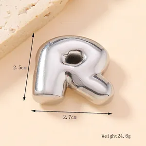 Detail view of silver bubble letter R pendant with dimensions 2.5cm and weight 24.6g
