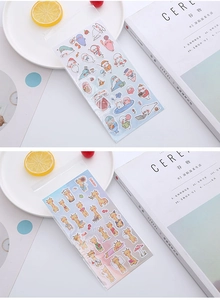 Close-up of cute cartoon seal and giraffe bubble stickers in clear packaging