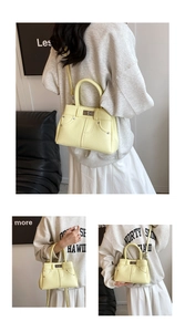 Detail of light yellow lychee textured leather crossbody bag with denim style stitching