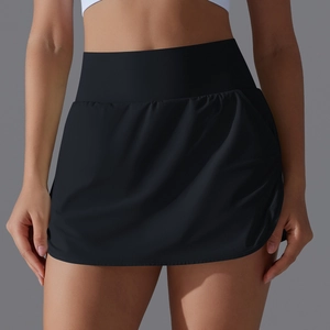 Detail view of high-waist black athletic skort showing tummy control and flared A-line cut
