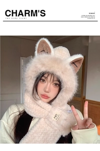 Detail showing the fluffy cream faux fur texture and cute fox ear design on this winter hat