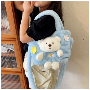 Blue plush bear handbag for girls showing soft texture and cute floral decoration