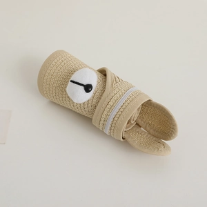 Foldable children's straw sun hat in light khaki with cute cartoon pompom decoration