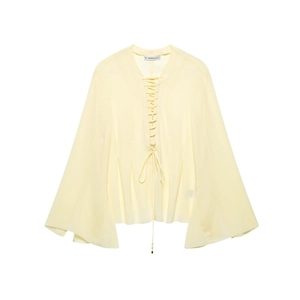 Light yellow chiffon blouse with tie V-neck and flared sleeves on white background