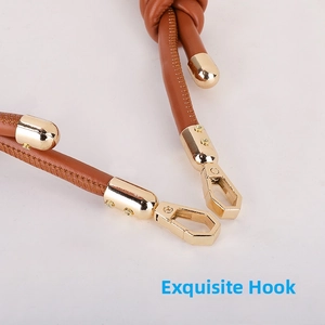 Detail of brown leather strap with adjustable knot and golden lobster clasp