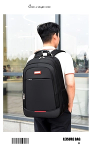 Detail view of water-resistant black business backpack with reinforced handle and red logo