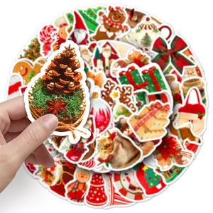 Detail shot of waterproof Christmas stickers with pine cone and gingerbread man patterns