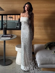Elegant strapless evening gown with white bodice and shimmering silver sequin floor-length skirt