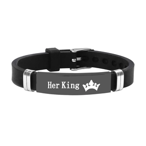 Close-up of adjustable black silicone strap with Her King engraved metal plate