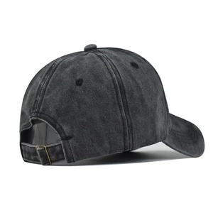 Detail view of washed black cotton baseball cap back with adjustable metal buckle strap