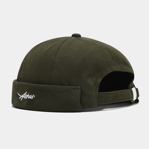 Detail of dark olive green docker hat with white Asher embroidery and adjustable strap