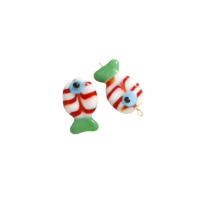 Handmade lampwork glass fish pendants with red spirals and green fins for jewelry making