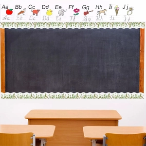 Detail of scalloped eucalyptus leaf and alphabet border stickers on a classroom chalkboard